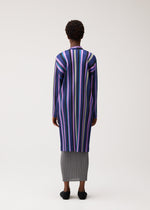 A model wears the PLEATS PLEASE ISSEY MIYAKE TAPE TAPE tape-tape-coat-purple.