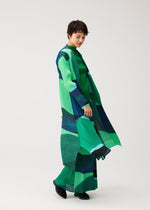 A model wears the PLEATS PLEASE ISSEY MIYAKE ORBIT orbit-coat-green.