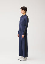 A model wears the PLEATS PLEASE ISSEY MIYAKE COTTON DENIM cotton-denim-jacket-navy-blue.