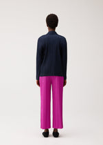 A model wears the PLEATS PLEASE ISSEY MIYAKE PLEATS JACKET pleats-jacket-jacket-charcoal.