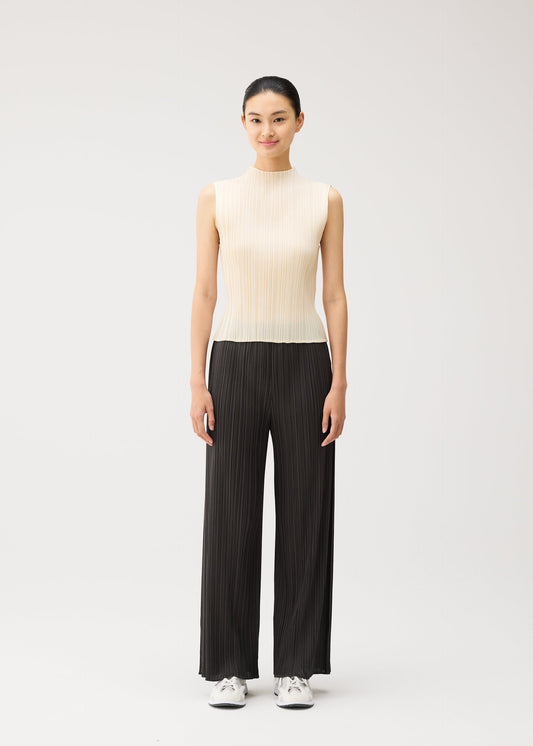 A model wears the PLEATS PLEASE ISSEY MIYAKE MONTHLY COLORS : AUGUST monthly-colors-august-trousers-greyish-purple.