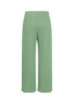 A detail shot of the PLEATS PLEASE ISSEY MIYAKE MONTHLY COLORS : AUGUST trousers.