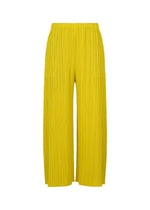 A product shot of the PLEATS PLEASE ISSEY MIYAKE MONTHLY COLORS : OCTOBER trousers in yellow ocher.