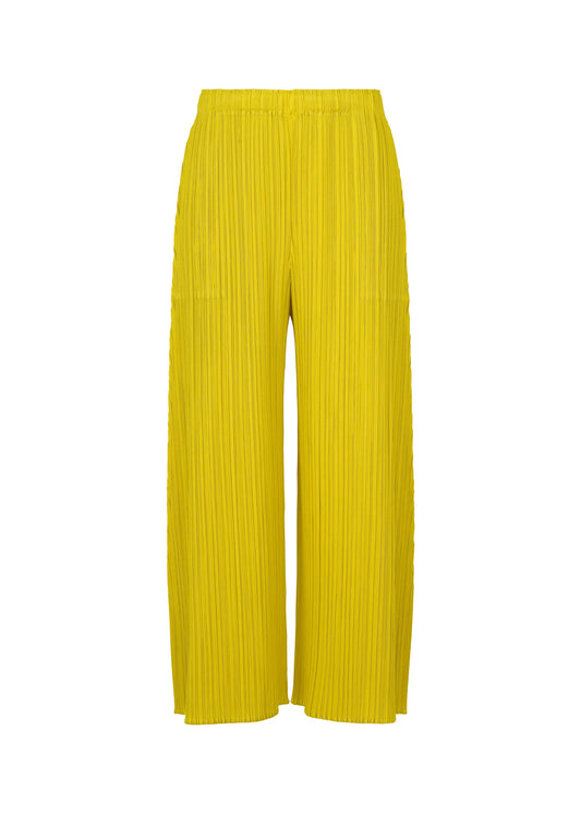 A product shot of the PLEATS PLEASE ISSEY MIYAKE MONTHLY COLORS : OCTOBER trousers in yellow ocher.