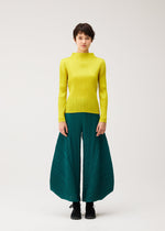 A model wears the PLEATS PLEASE ISSEY MIYAKE MONTHLY COLORS : OCTOBER monthly-colors-october-flared-trousers-ash-beige.