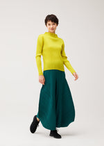A model wears the PLEATS PLEASE ISSEY MIYAKE MONTHLY COLORS : OCTOBER monthly-colors-october-flared-trousers-dark-green.