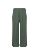 A product shot of the PLEATS PLEASE ISSEY MIYAKE COTTON DENIM trousers in dark green.