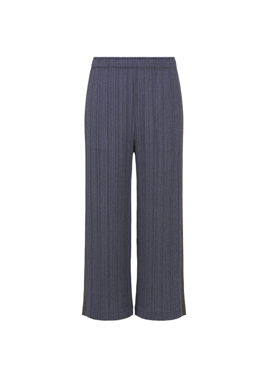A product shot of the PLEATS PLEASE ISSEY MIYAKE COTTON DENIM trousers in navy blue.