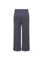 A detail shot of the PLEATS PLEASE ISSEY MIYAKE COTTON DENIM trousers.