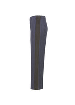 A detail shot of the PLEATS PLEASE ISSEY MIYAKE COTTON DENIM trousers.