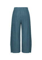 A detail shot of the PLEATS PLEASE ISSEY MIYAKE MELLOW PLEATS trousers.