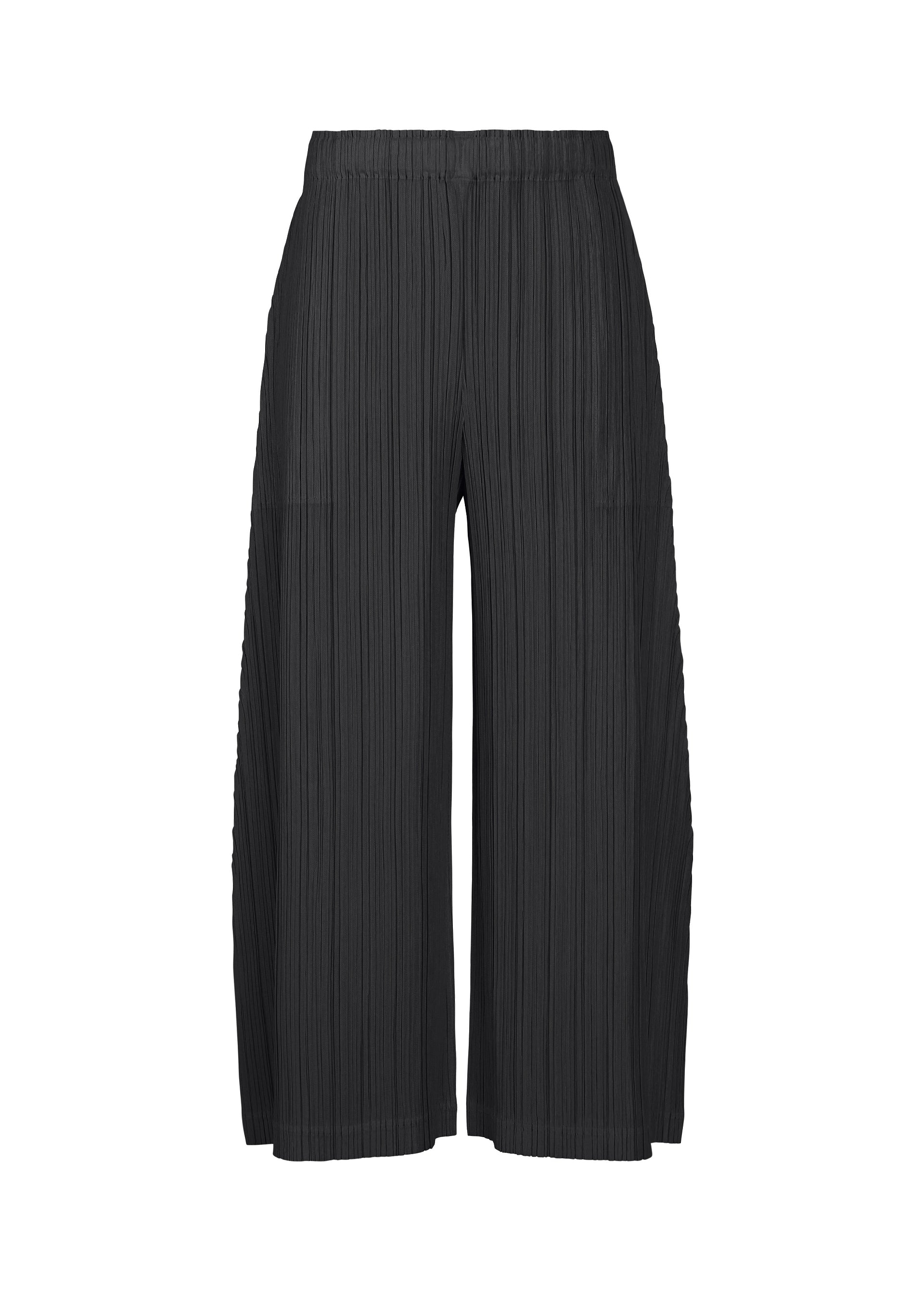 A product shot of the PLEATS PLEASE ISSEY MIYAKE THICKER BOTTOMS 1 trousers in black.