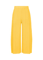 A product shot of the PLEATS PLEASE ISSEY MIYAKE THICKER BOTTOMS 1 trousers in yellow.