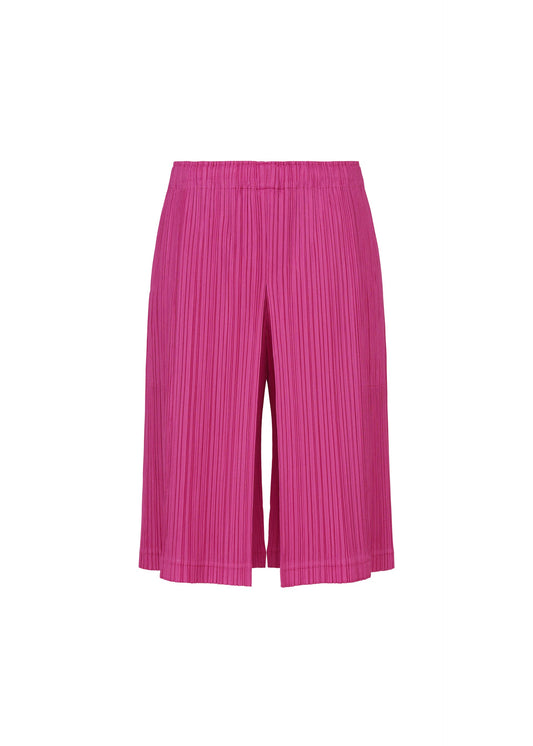 A product shot of the PLEATS PLEASE ISSEY MIYAKE THICKER BOTTOMS 2 trousers in magenta.