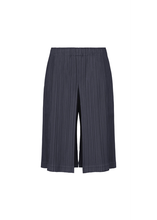 A product shot of the PLEATS PLEASE ISSEY MIYAKE THICKER BOTTOMS 2 trousers in navy.