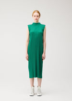 A model wears the PLEATS PLEASE ISSEY MIYAKE MONTHLY COLORS : JULY dress.