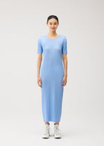 A model wears the PLEATS PLEASE ISSEY MIYAKE MONTHLY COLORS : AUGUST monthly-colors-august-dress-greyish-green.