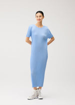 A model wears the PLEATS PLEASE ISSEY MIYAKE MONTHLY COLORS : AUGUST monthly-colors-august-dress-greyish-green.