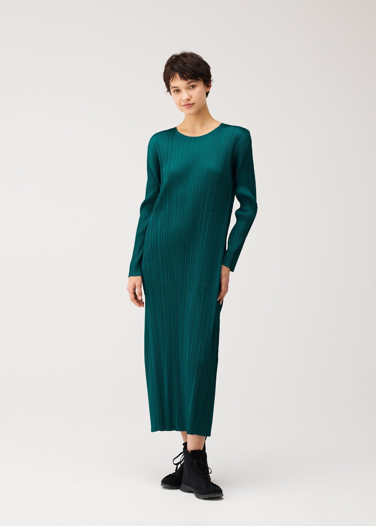 A model wears the PLEATS PLEASE ISSEY MIYAKE MONTHLY COLORS : OCTOBER monthly-colors-october-midi-dress-ash-beige.