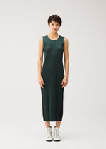 A model wears the PLEATS PLEASE ISSEY MIYAKE COTTON DENIM cotton-denim-dress-navy-blue.