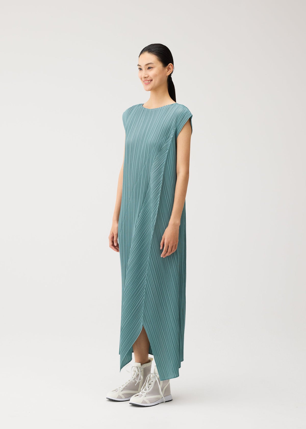 A model wears the PLEATS PLEASE ISSEY MIYAKE FOLD fold-dress-baby-blue.