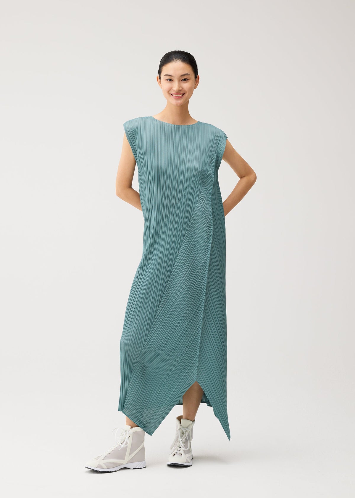 A model wears the PLEATS PLEASE ISSEY MIYAKE FOLD fold-dress-mint-green.