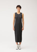 A model wears the PLEATS PLEASE ISSEY MIYAKE COTTON DENIM BLACK cotton-denim-black-dress-black.