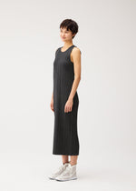 A model wears the PLEATS PLEASE ISSEY MIYAKE COTTON DENIM BLACK cotton-denim-black-dress-black.