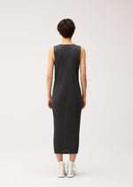 A model wears the PLEATS PLEASE ISSEY MIYAKE COTTON DENIM BLACK cotton-denim-black-dress-black.