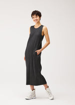 A model wears the PLEATS PLEASE ISSEY MIYAKE COTTON DENIM BLACK cotton-denim-black-dress-black.