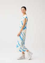 A model wears the PLEATS PLEASE ISSEY MIYAKE FOLD LINE fold-line-dress-off-white.