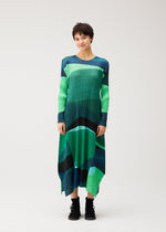A model wears the PLEATS PLEASE ISSEY MIYAKE ORBIT orbit-a-line-dress-yellow.