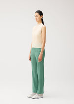 A model wears the PLEATS PLEASE ISSEY MIYAKE MONTHLY COLORS : AUGUST monthly-colors-august-high-neck-top-light-blue.
