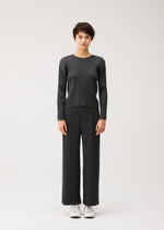 A model wears the PLEATS PLEASE ISSEY MIYAKE COTTON DENIM BLACK cotton-denim-black-top-black.