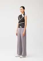 A model wears the PLEATS PLEASE ISSEY MIYAKE FOLD LINE fold-line-top-off-white.