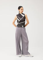 A model wears the PLEATS PLEASE ISSEY MIYAKE FOLD LINE fold-line-top-charcoal.