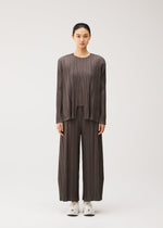 A model wears the PLEATS PLEASE ISSEY MIYAKE MELLOW PLEATS mellow-pleats-cardigan-cerulean-blue.
