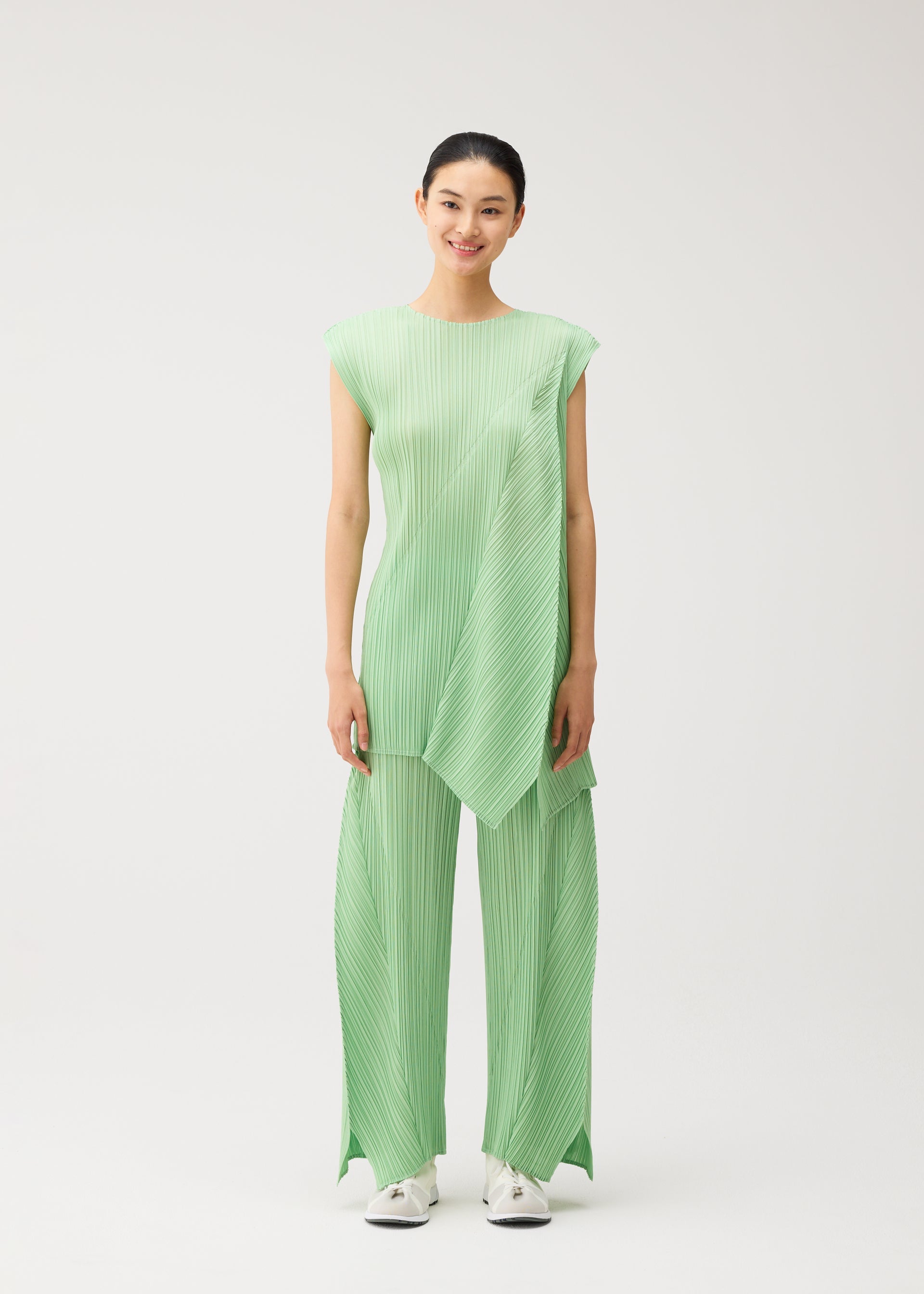 A model wears the PLEATS PLEASE ISSEY MIYAKE FOLD fold-tunic-baby-blue.