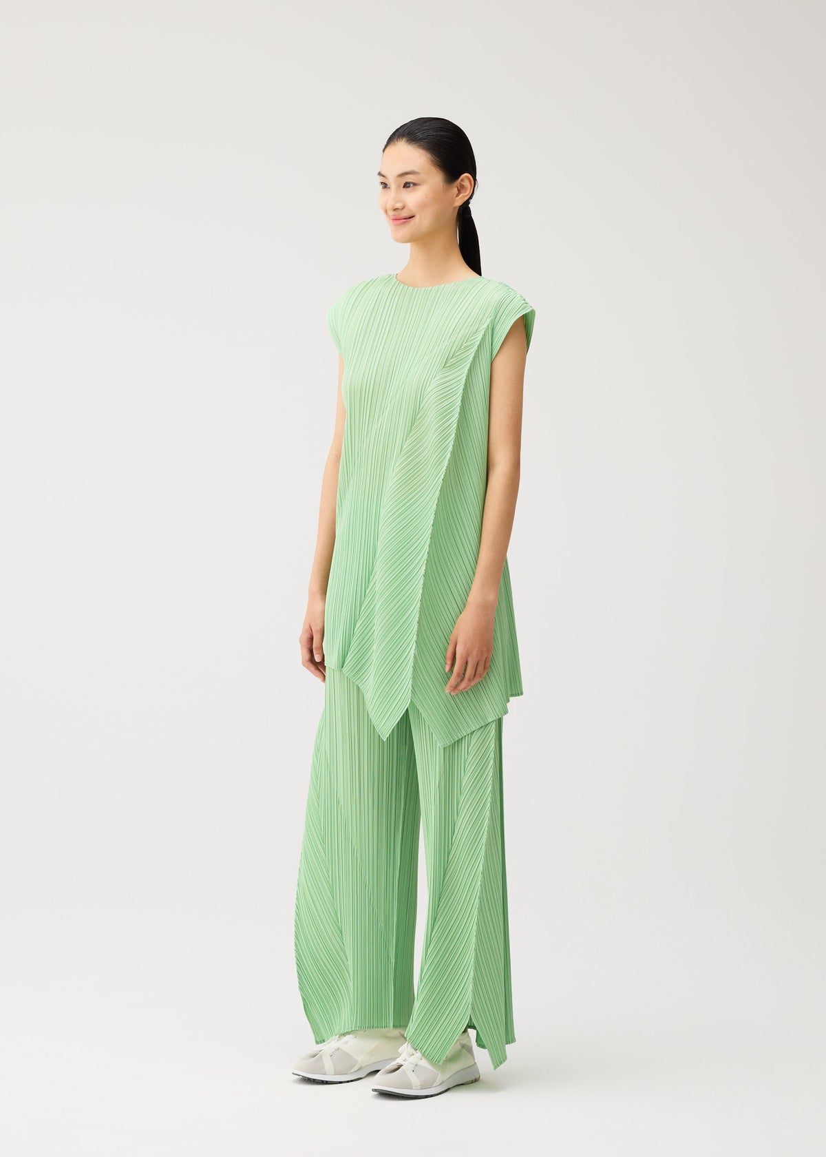 A model wears the PLEATS PLEASE ISSEY MIYAKE FOLD fold-tunic-baby-blue.