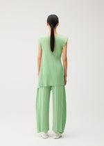 A model wears the PLEATS PLEASE ISSEY MIYAKE FOLD fold-tunic-black.