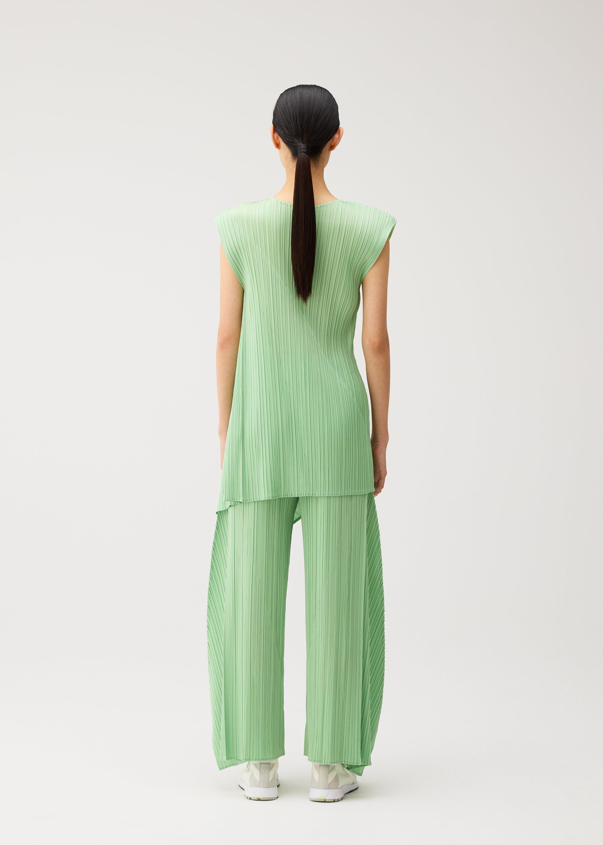 A model wears the PLEATS PLEASE ISSEY MIYAKE FOLD fold-tunic-baby-blue.