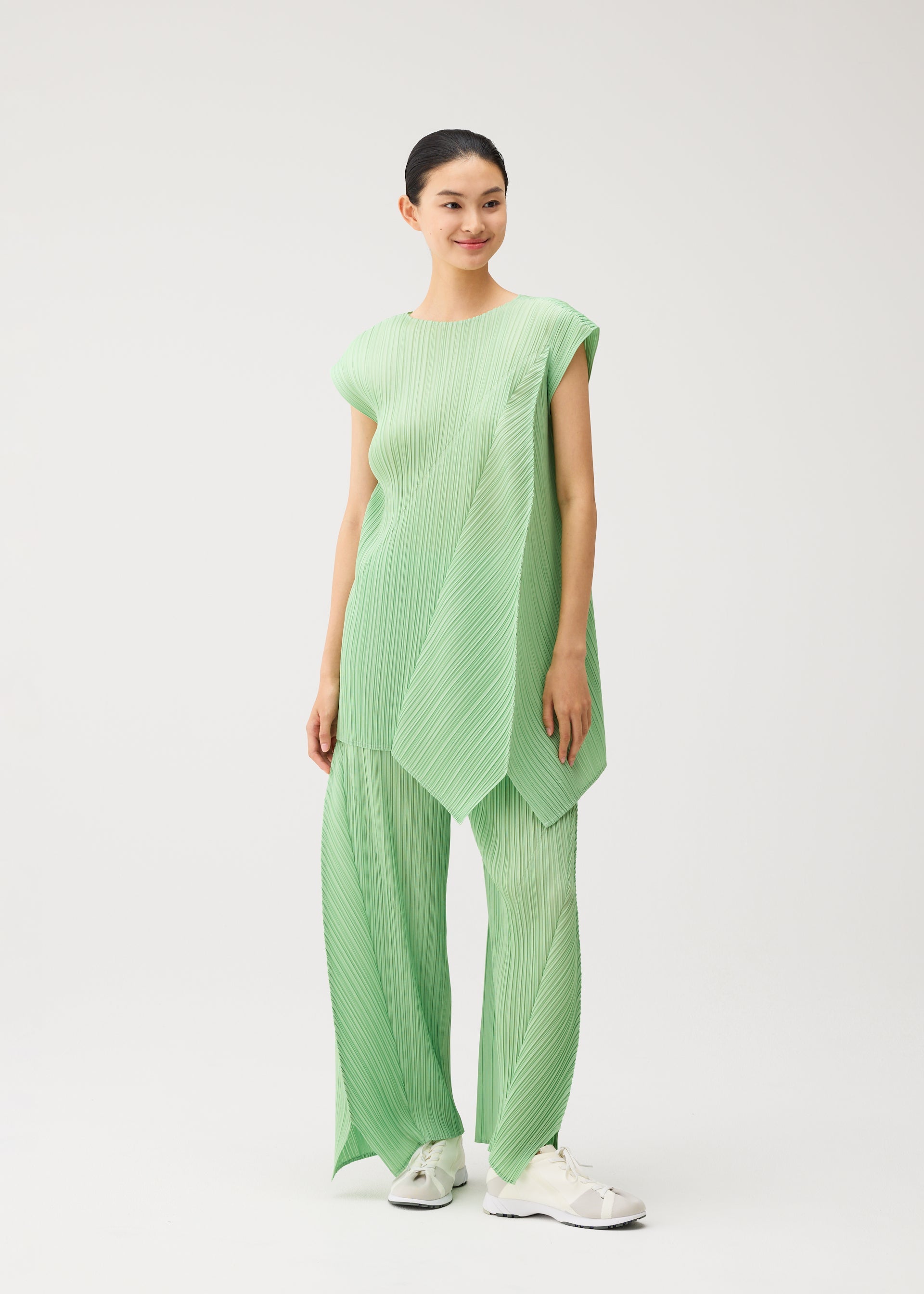 A model wears the PLEATS PLEASE ISSEY MIYAKE FOLD fold-tunic-baby-blue.