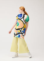 A model wears the PLEATS PLEASE ISSEY MIYAKE ROLL roll-dress-light-blue-1.
