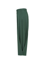 A detail shot of the PLEATS PLEASE ISSEY MIYAKE A-POC BOTTOMS trousers.