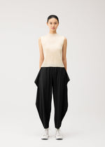 A model wears the PLEATS PLEASE ISSEY MIYAKE A-POC BOTTOMS a-poc-bottoms-side-drape-trousers-black.