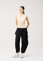 A model wears the PLEATS PLEASE ISSEY MIYAKE A-POC BOTTOMS a-poc-bottoms-side-drape-trousers-black.