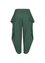 A detail shot of the PLEATS PLEASE ISSEY MIYAKE A-POC BOTTOMS trousers.