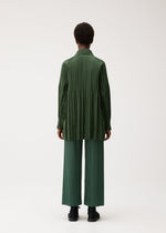 A model wears the PLEATS PLEASE ISSEY MIYAKE SMOOTH COAT smooth-coat-coat-black-3.