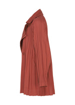 A detail shot of the PLEATS PLEASE ISSEY MIYAKE SMOOTH COAT coat.