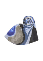 A detail shot of the PLEATS PLEASE ISSEY MIYAKE ROLL MADAME-T stole.